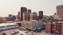 Zooming in on misc tall buildings in downtown Saint Louis, Missouri on a clear sky morning.