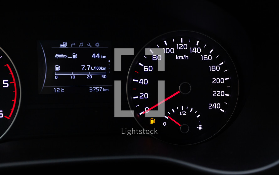 Fuel consumption theme. Empty tank indicator on car dashboard
