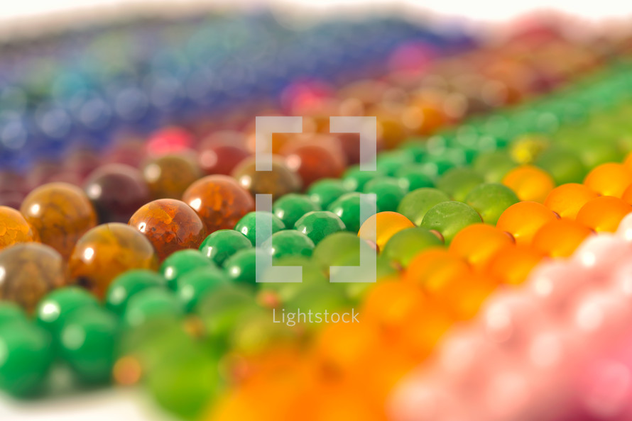Mixed colors beads close-up made from natural stones or glass marbles