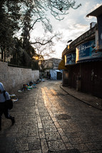trash along a narrow street in Jerusalem 