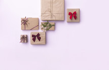 Top-Down View of Wrapped Christmas Gifts on Pink Background