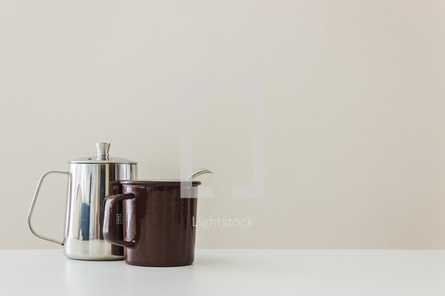 silver coffee pot and mug 