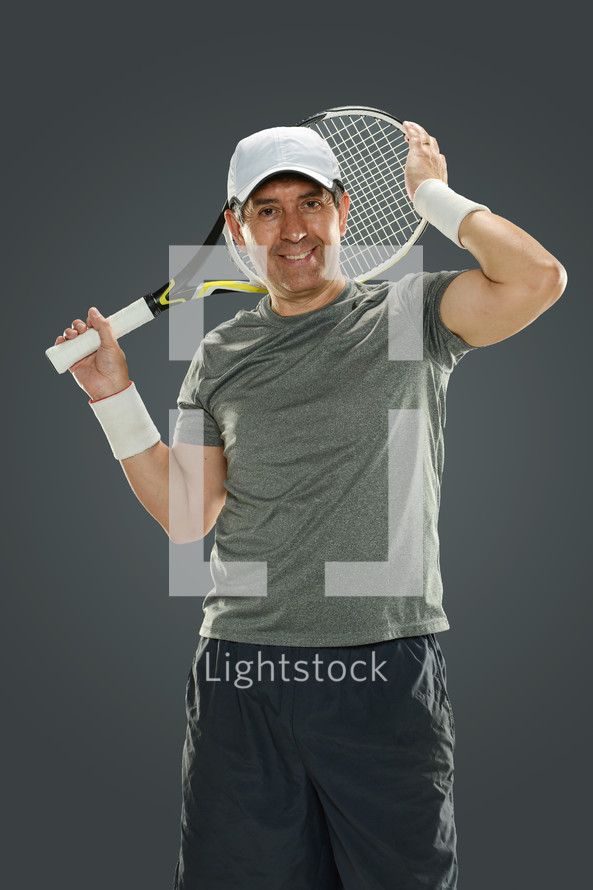 a man holding a tennis racket 