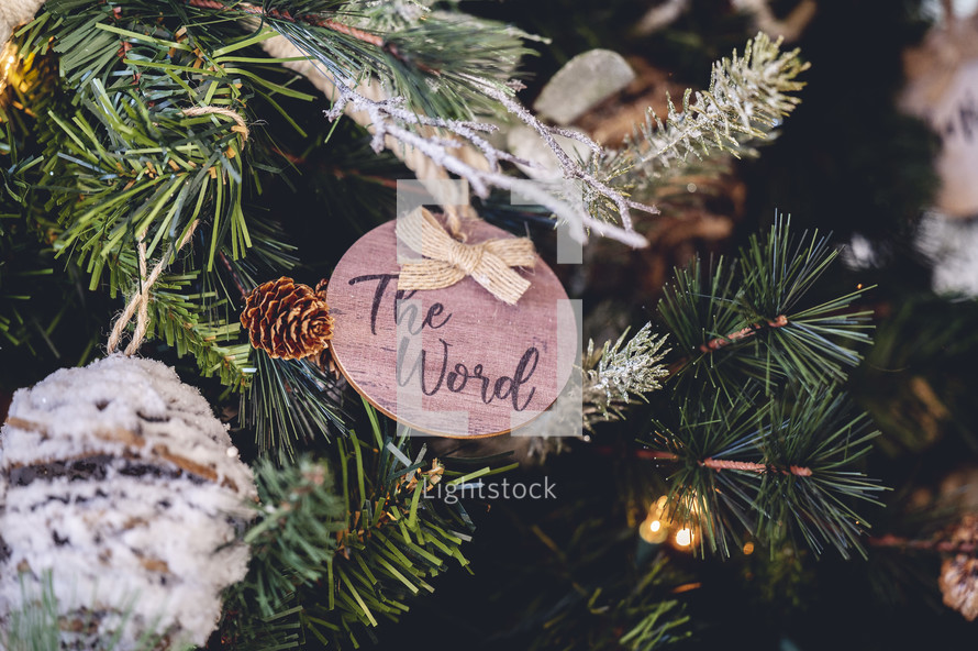 Wooden ornament with the word "the Word" on a Christmas tree 