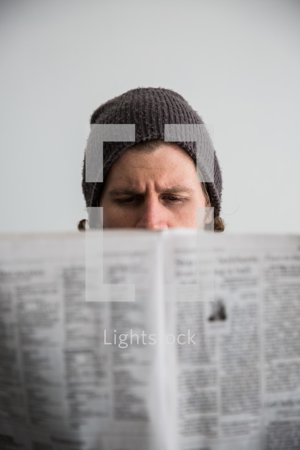 man reading a newspaper 