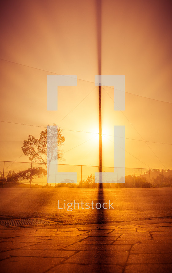 intense glow of sunlight onto a parking lot 