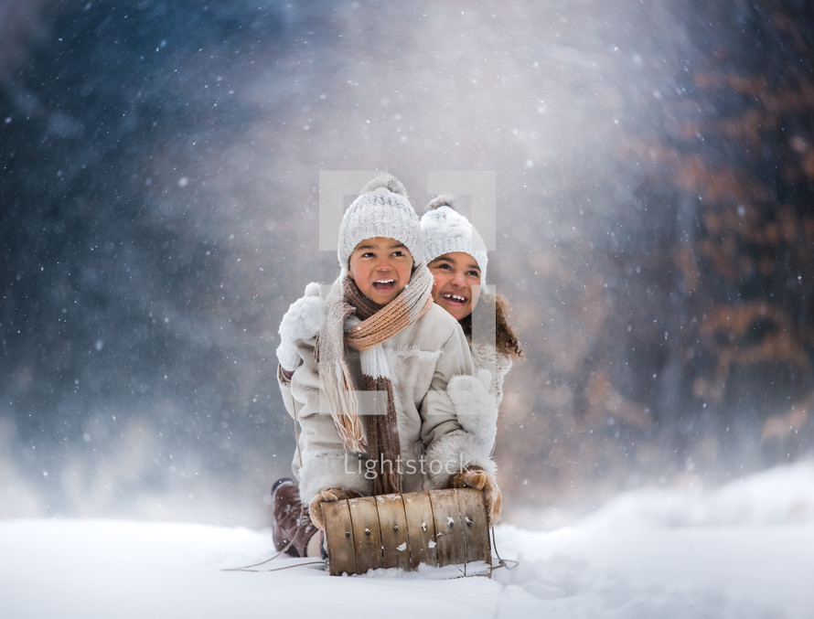 happy children on a sleigh 
