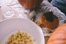 taking seeds out of a pumpkin