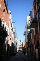 narrow street between buildings 