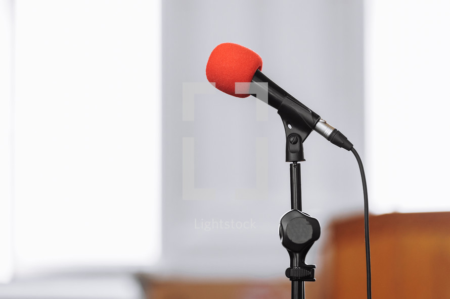 microphone on stage in business seminar, speech presentation, town meeting, lecture hall, conference room in corporate or community event. Business, education and technology concept. copy space.