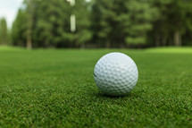 golf ball on a putting green 