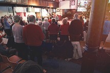 congregation singing Christmas hymns at a worship service 