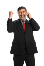Man talking on a cellphone celebrating 