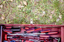  a red toolbox full of tools 