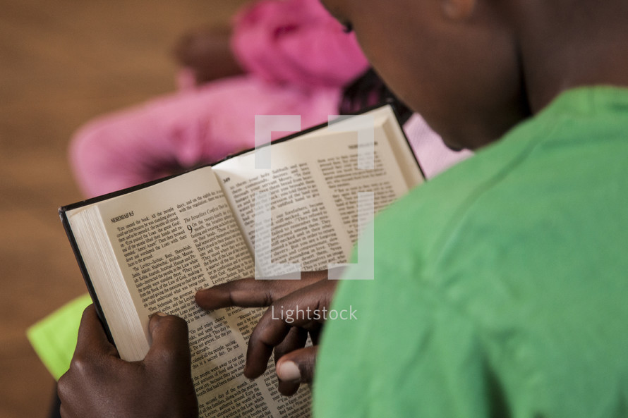 boy child reading a Bible