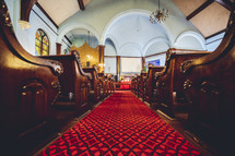 red carpet in a church ailse 