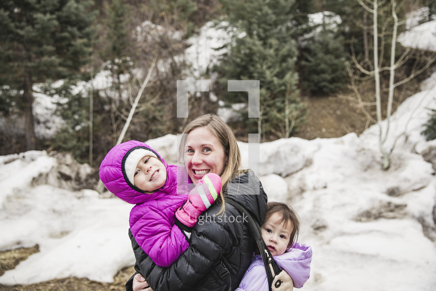 mother and children outdoors in winter 