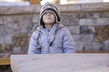 a child in a winter beanie 