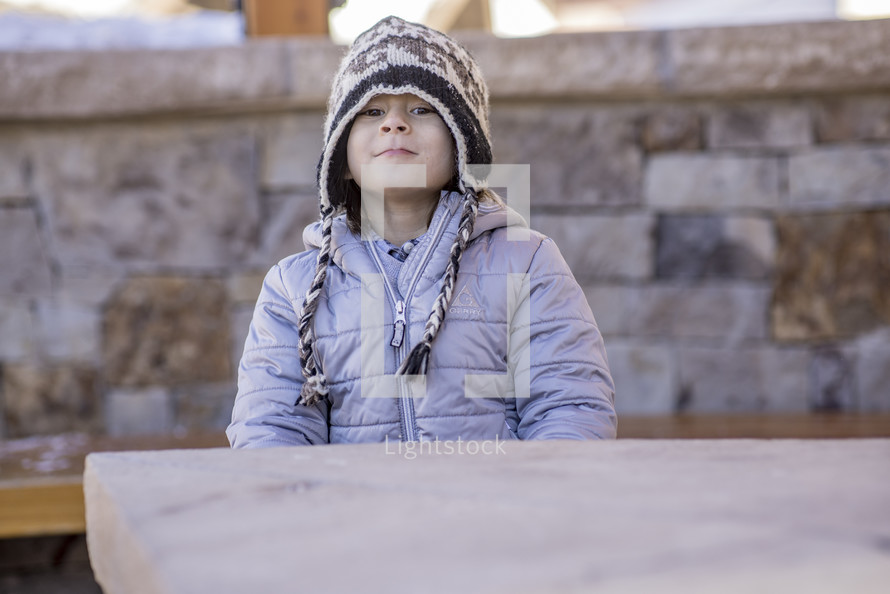 a child in a winter beanie 