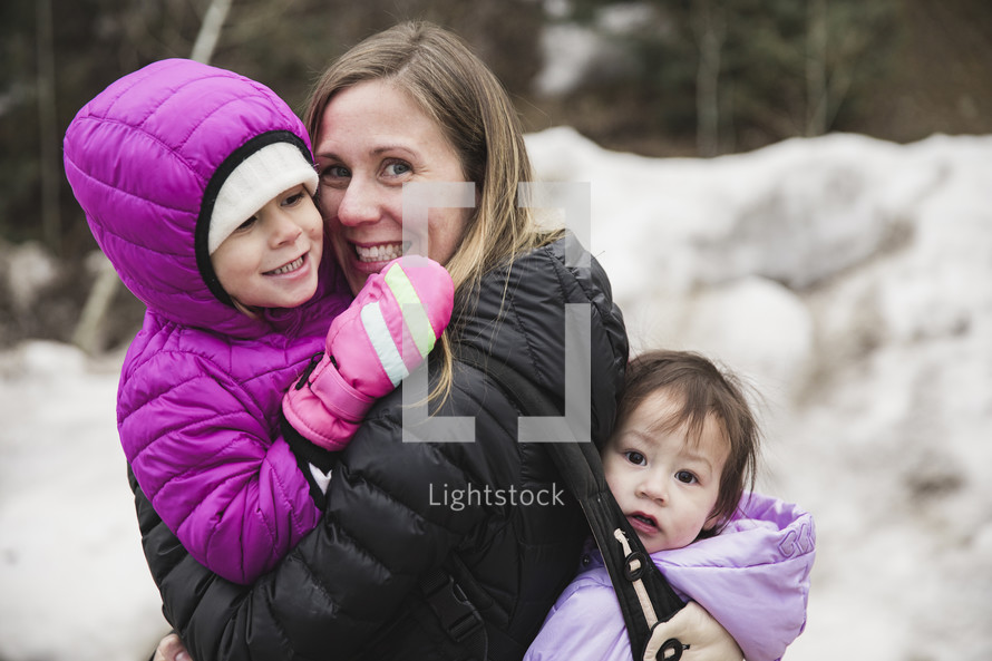 mother and children outdoors in winter 