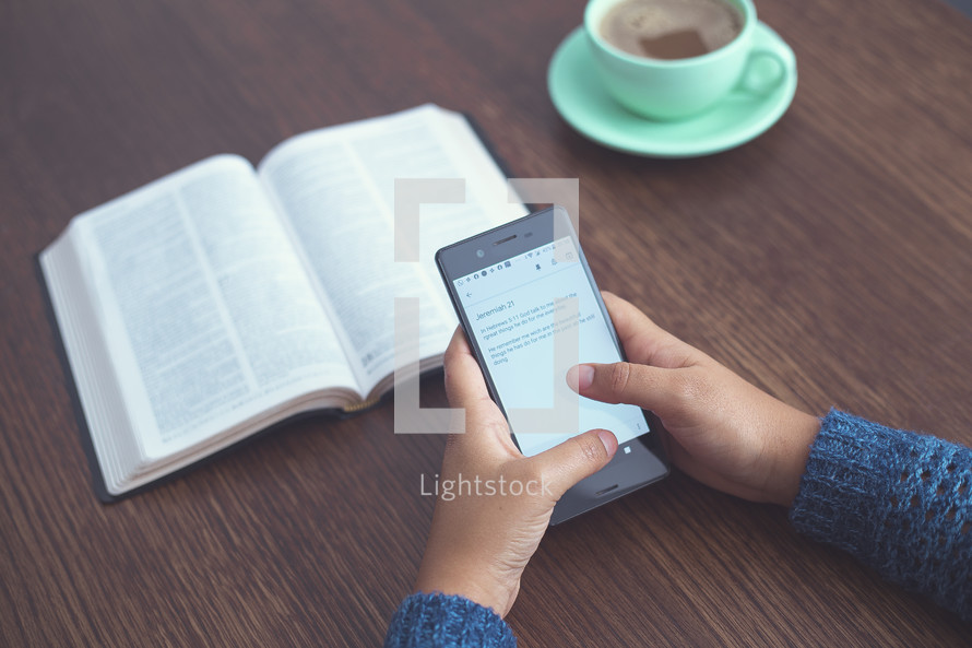 Bible app, opened Bible, and coffee cup 