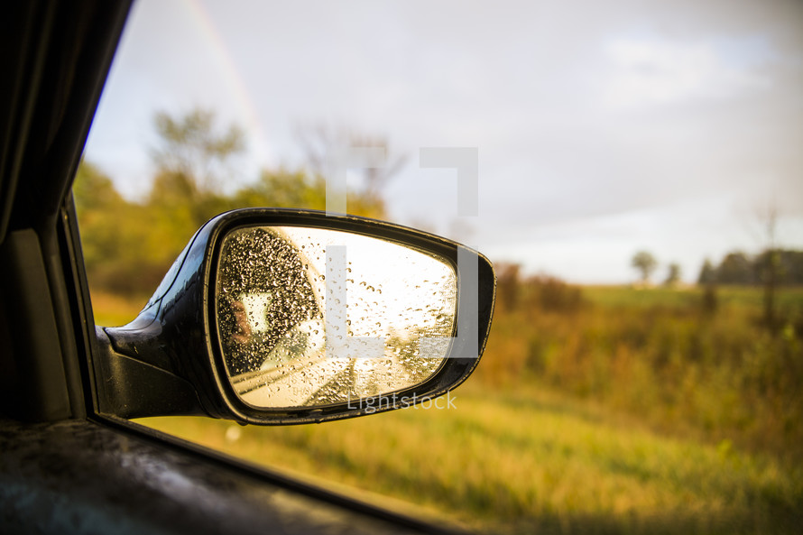 rain drops on a car mirror 