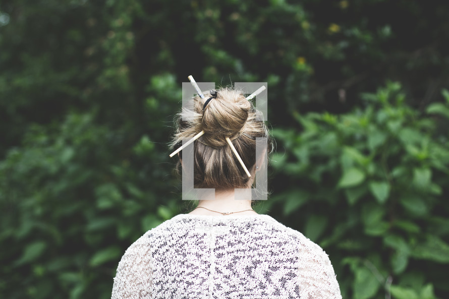 a woman with a bun in her hair 