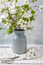 vase of white dogwood flowers 