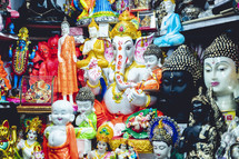 Multiple Hindu gods in a street market in India.