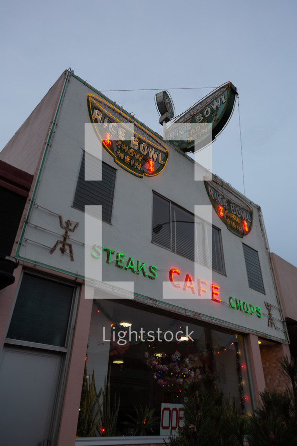 Small town restaurant with neon sign and Christmas lights