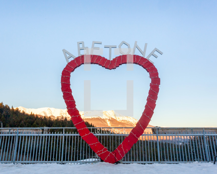 Abetone, Italy - December 19, 2023: famous mountain location in Tuscany. Red heart with the city name written on it.