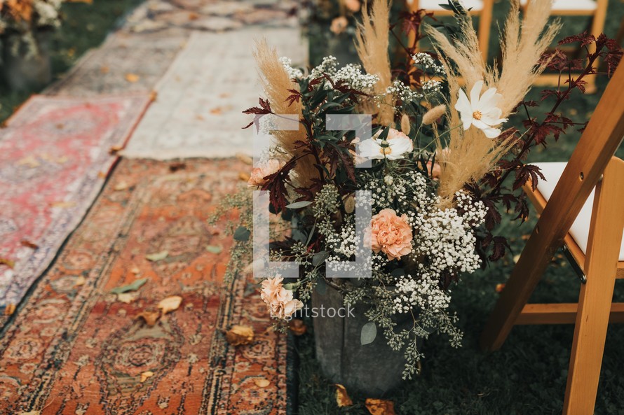 aisle made of rugs for an outdoor wedding 