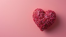 Textured heart shape on a soft pink background
