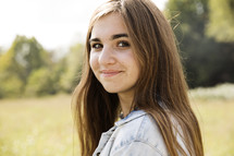 a brunette teen girl posing for a portrait 