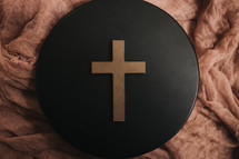 cross on a black circle 