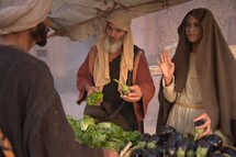 men and women shopping at a market in biblical times 