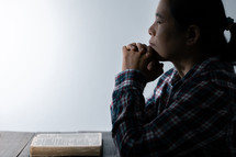 White background and woman praying with Bible