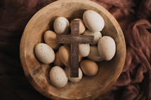 bowl with speckled eggs and cross 