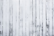 white, weathered wooden fence.