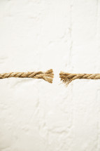 Frayed ends of a rope on a white background.