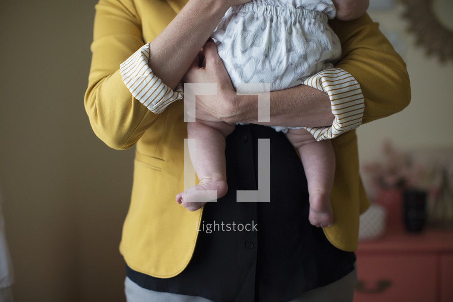 mother holding her infant daughter 
