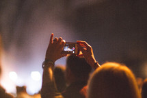filming a concert on a cellphone 