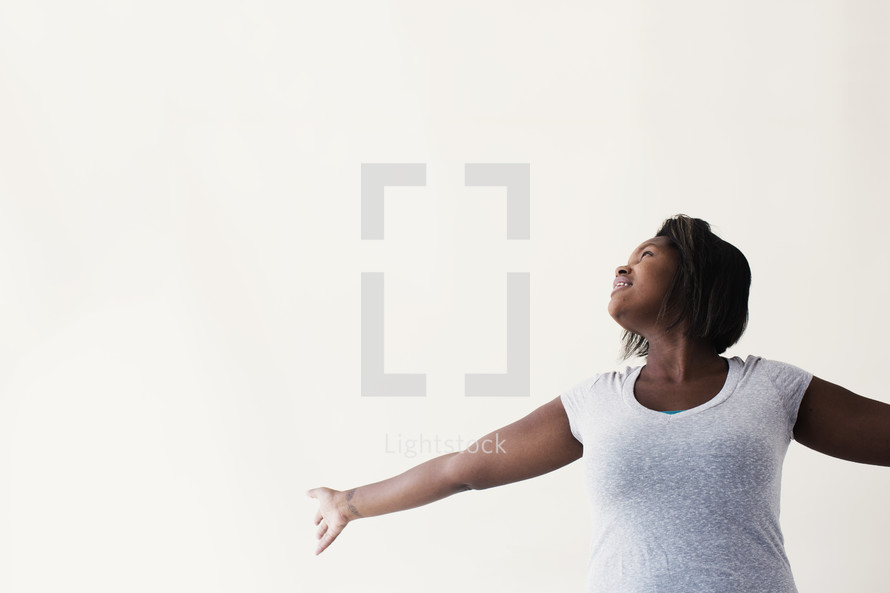 African-American woman with outstretched arms 
