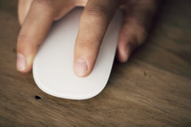 close up of a hand on a computer mouse.