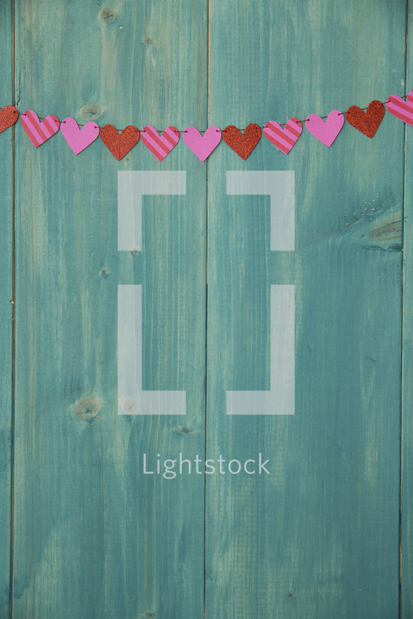 hearts on a teal wall 