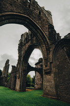 Landmarks of Wales travel concept. View of ancient ruins of the castle/church in Brecon Beacons National Park, United Kingdom. Llanthony Priory Abbey in the Vale of Ewyas. Llanthony priory ruins.
