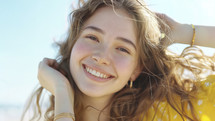 Sunny teen portrait, joyful expression, beach day.