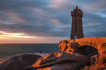 lighthouse on a rocky beach 