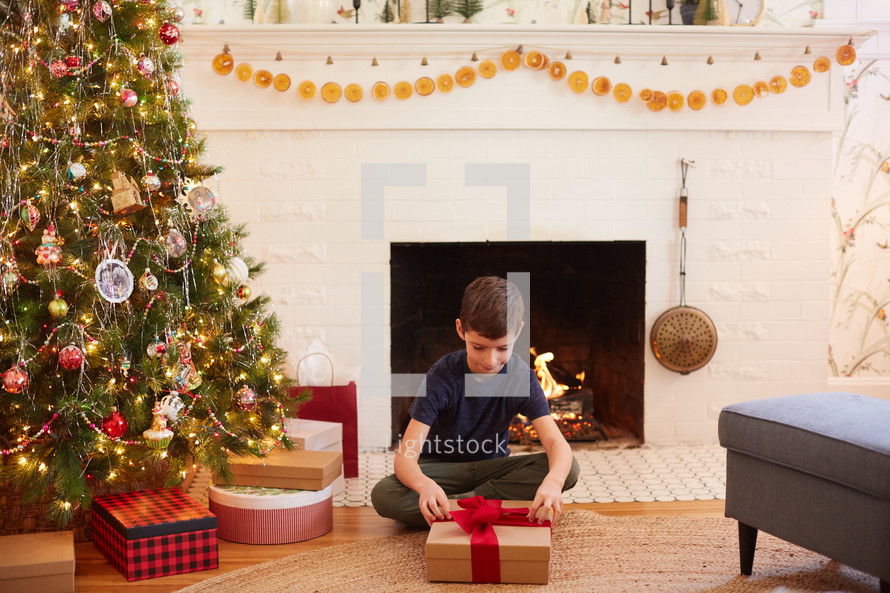 boy opening a Christmas present 