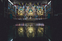 Golden statues inside of a Buddhist temple. 